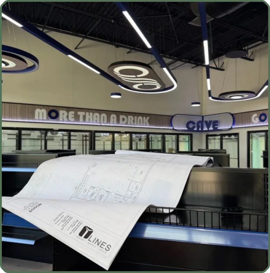 Blueprints laid over shelving in a finished store