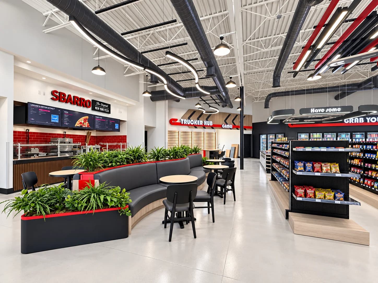 Truck stop interior with a pizza counter, curved seating, trucker hub and c-store aisles